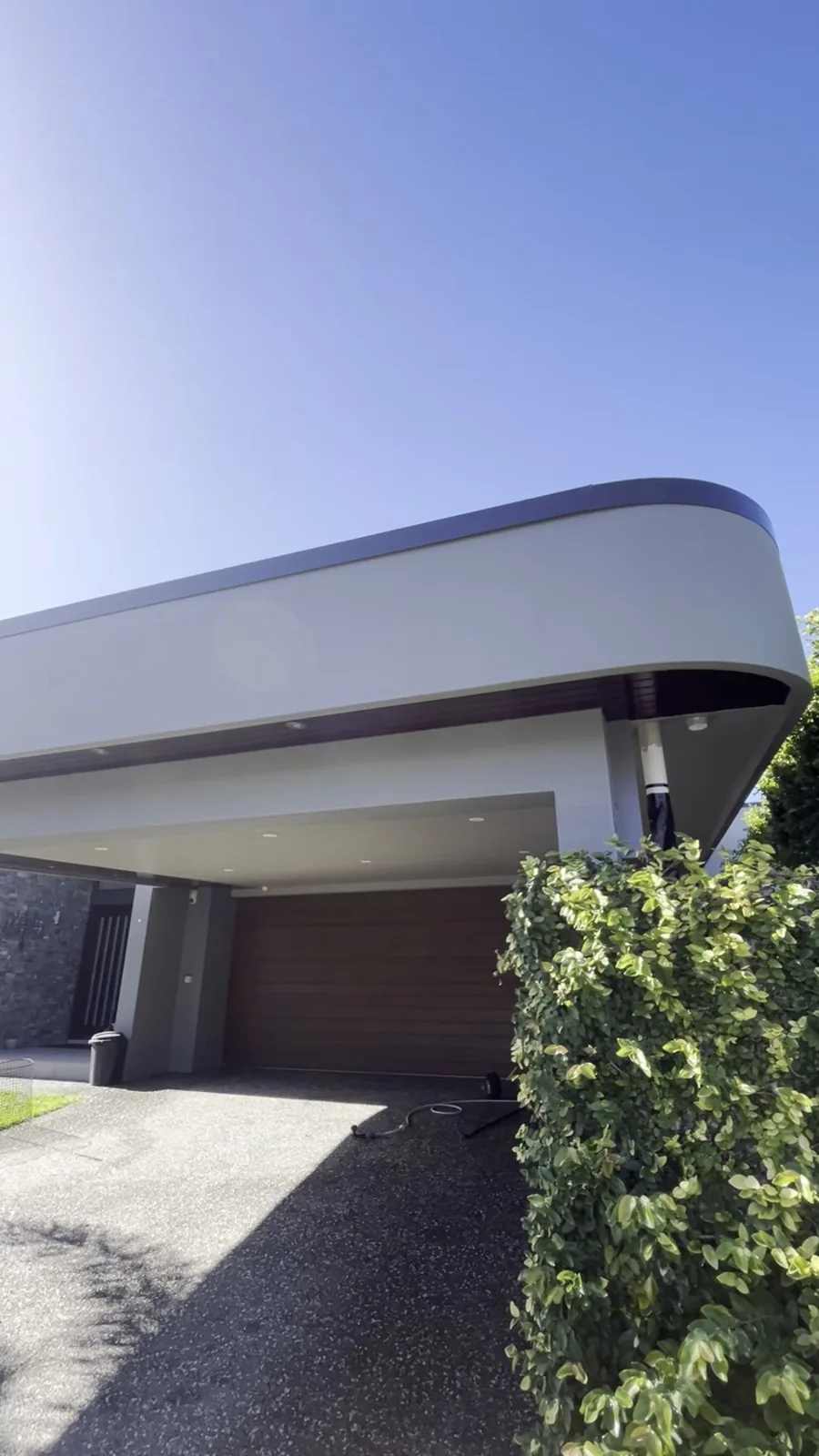 Custom curved-roof carport exterior, Gold Coast